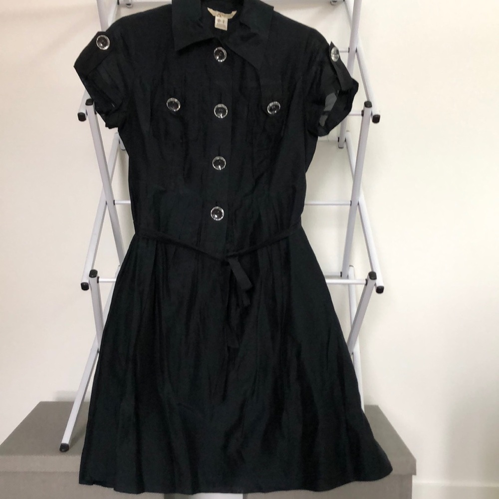 Black knee length dress with  clear buttons